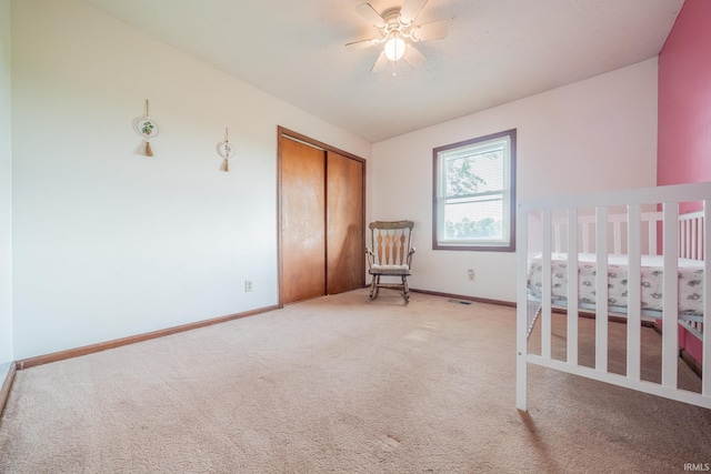 602 S Maple St, Galveston, IN 46932 - bedroom featuring light carpet, a closet, and ceiling fan