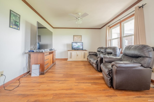 602 S Maple St, Galveston, IN 46932 - living room with ornamental molding, light wood finished floors, and a ceiling fan