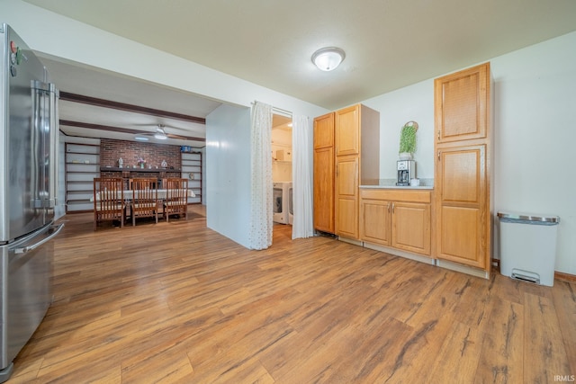 602 S Maple St, Galveston, IN 46932 - living area featuring light wood finished floors, a ceiling fan, and washer / dryer