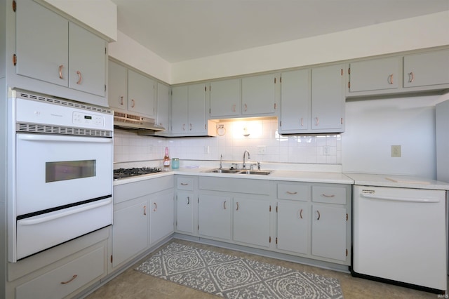 708 Carson Ct, Kokomo, IN 46902 - kitchen featuring a warming drawer, white appliances, under cabinet range hood, backsplash, and light countertops