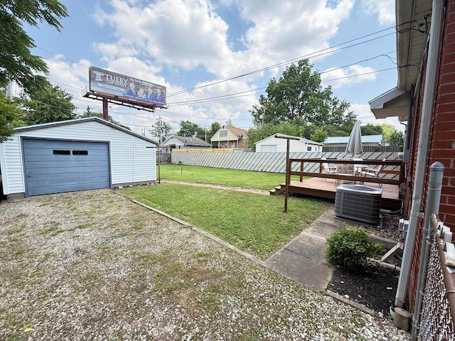 16 S Taft Ave, Evansville, IN 47714 - view of yard with an outdoor structure, driveway, a wooden deck, and a detached garage