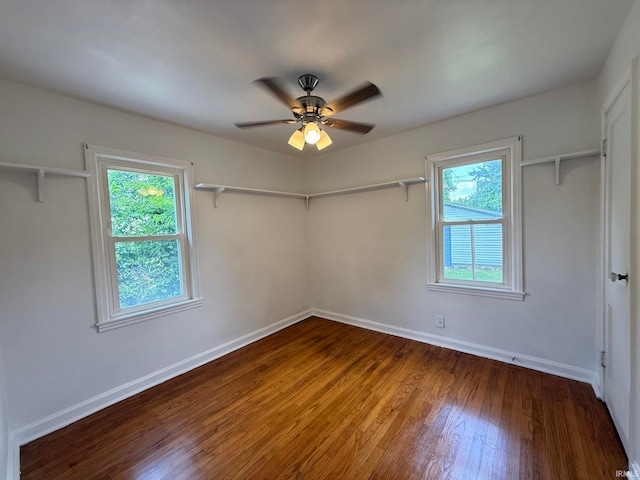 16 S Taft Ave, Evansville, IN 47714 - unfurnished bedroom with wood finished floors, multiple windows, and ceiling fan