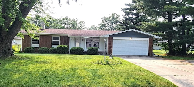 113 N Beechwood St, Warsaw, IN 46582 - single story home with a front yard, a garage, concrete driveway, a chimney, and brick siding