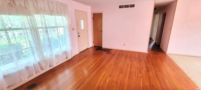 113 N Beechwood St, Warsaw, IN 46582 - unfurnished room featuring wood finished floors and healthy amount of natural light
