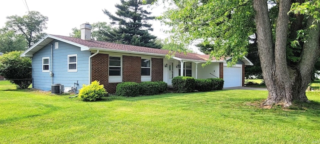 113 N Beechwood St, Warsaw, IN 46582 - view of front of property featuring an attached garage, a chimney, driveway, and brick siding