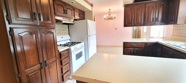 113 N Beechwood St, Warsaw, IN 46582 - kitchen featuring under cabinet range hood, white appliances, a chandelier, decorative backsplash, and light countertops