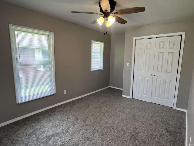 723 E N St, Kokomo, IN 46901 - unfurnished bedroom featuring dark colored carpet, a closet, and ceiling fan