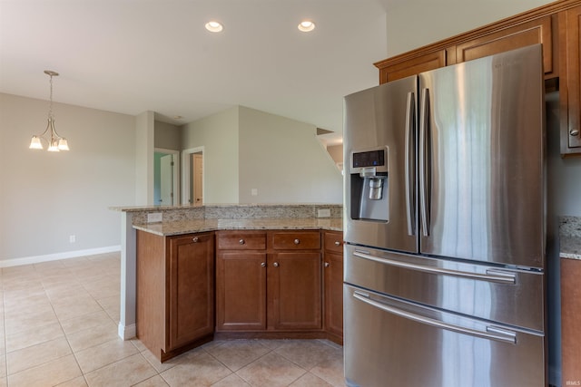 7655 Briar Ct, Newburgh, IN 47630 - kitchen with stainless steel refrigerator with ice dispenser, a peninsula, brown cabinetry, light tile patterned floors, and recessed lighting