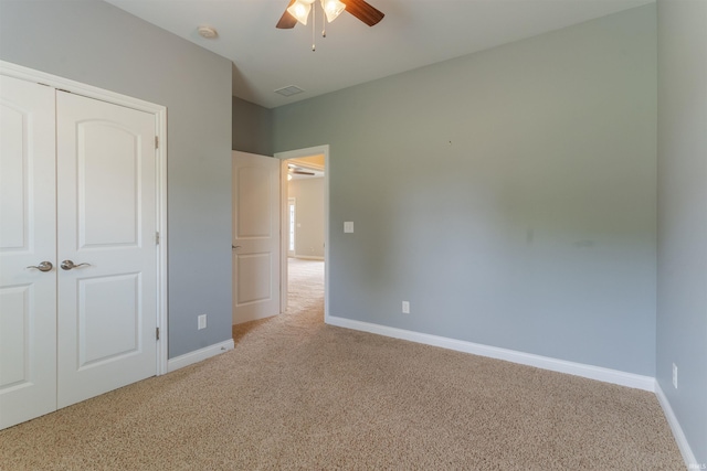 7655 Briar Ct, Newburgh, IN 47630 - unfurnished bedroom with carpet, a closet, and a ceiling fan