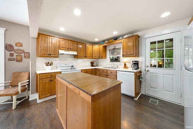 17612 State Road 37, Harlan, IN 46743 - kitchen with white appliances, under cabinet range hood, dark wood finished floors, recessed lighting, and a center island