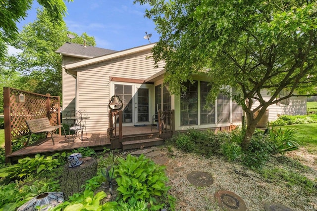 17612 State Road 37, Harlan, IN 46743 - rear view of house featuring a wooden deck and a sunroom