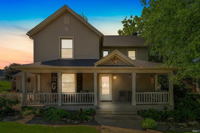 17612 State Road 37, Harlan, IN 46743 - view of front facade with covered porch and a shingled roof