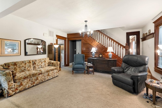 17612 State Road 37, Harlan, IN 46743 - living area featuring a chandelier, carpet flooring, and stairs