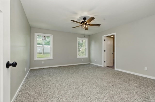1724 28th St, Bedford, IN 47421 - spare room with a ceiling fan, carpet floors, and plenty of natural light