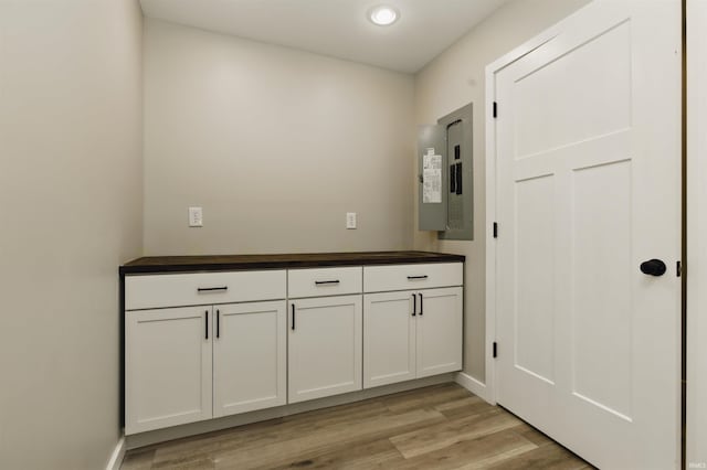 1724 28th St, Bedford, IN 47421 - washroom with electric panel, light wood-style flooring, and recessed lighting