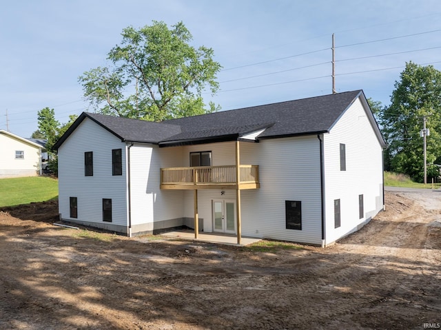 1724 28th St, Bedford, IN 47421 - back of house featuring french doors, a patio area, and roof with shingles