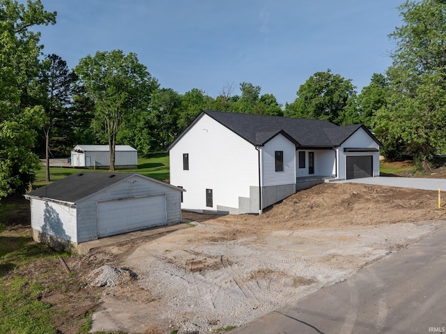 1724 28th St, Bedford, IN 47421 - view of front of house featuring an outdoor structure and view of scattered trees