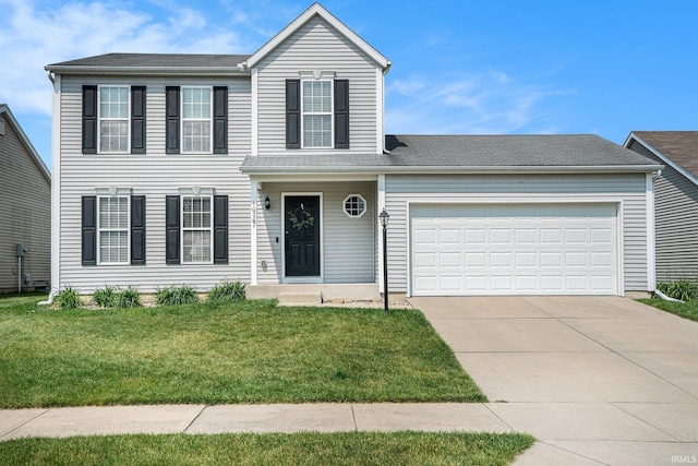 1927 Miniature Rose Ln, Mishawaka, IN 46544 - view of front of home with driveway, an attached garage, and a front yard