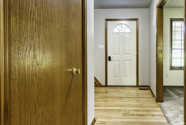 2560 E Maple Dr, Bluffton, IN 46714 - entryway with light wood finished floors and baseboards