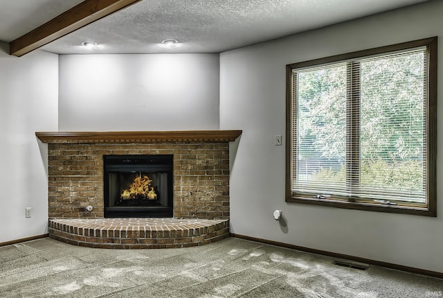2560 E Maple Dr, Bluffton, IN 46714 - detailed view of carpet, a fireplace, and a textured ceiling