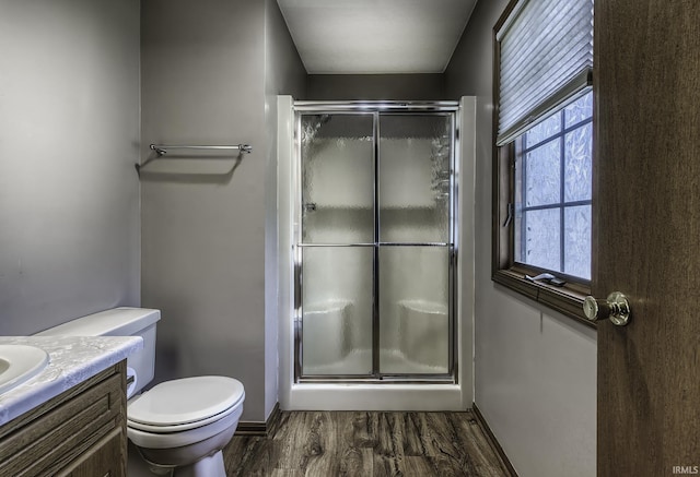 2560 E Maple Dr, Bluffton, IN 46714 - full bath featuring wood finished floors, a stall shower, and vanity