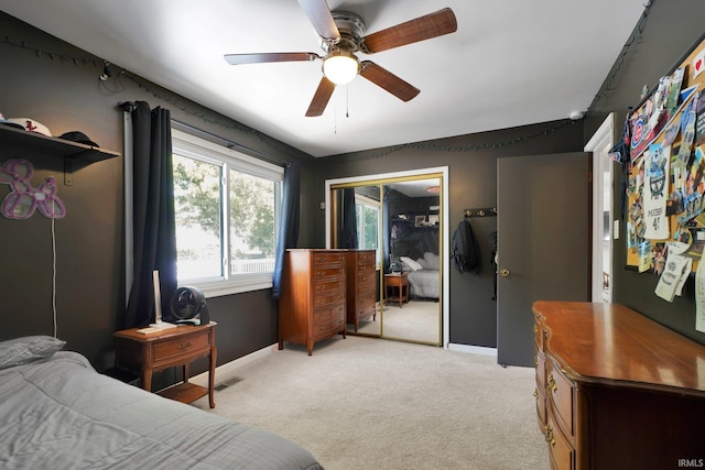 7244 Oaklawn Dr, Newburgh, IN 47630 - bedroom featuring light colored carpet, a ceiling fan, and a closet