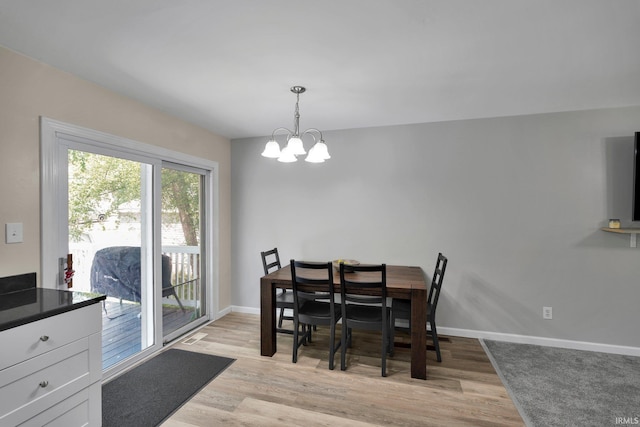 7244 Oaklawn Dr, Newburgh, IN 47630 - dining room featuring a chandelier and light wood-type flooring