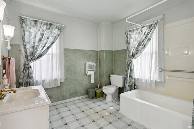 29351 Darden Rd, New Carlisle, IN 46552 - bathroom with plenty of natural light, a bathtub, tile patterned floors, and vanity