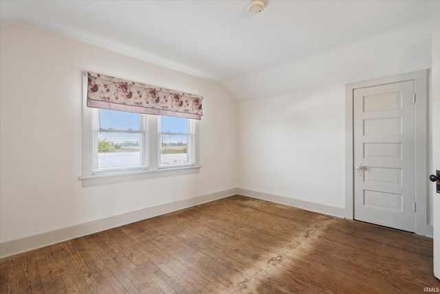 29351 Darden Rd, New Carlisle, IN 46552 - spare room with vaulted ceiling, a smoke detector, and wood-type flooring