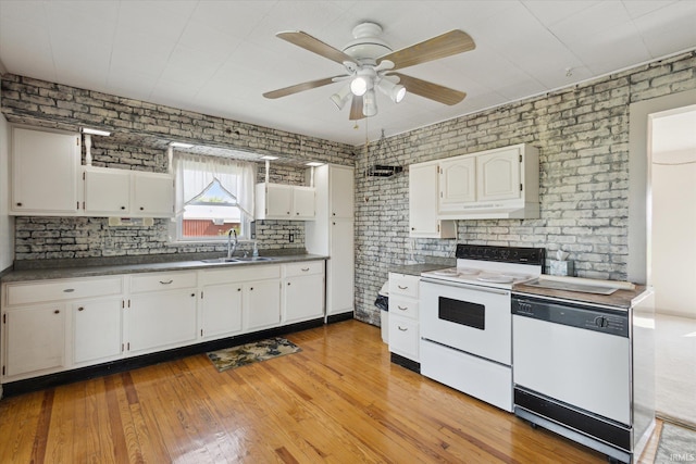 29351 Darden Rd, New Carlisle, IN 46552 - kitchen featuring white appliances, ceiling fan, white cabinetry, light wood-style flooring, and brick wall