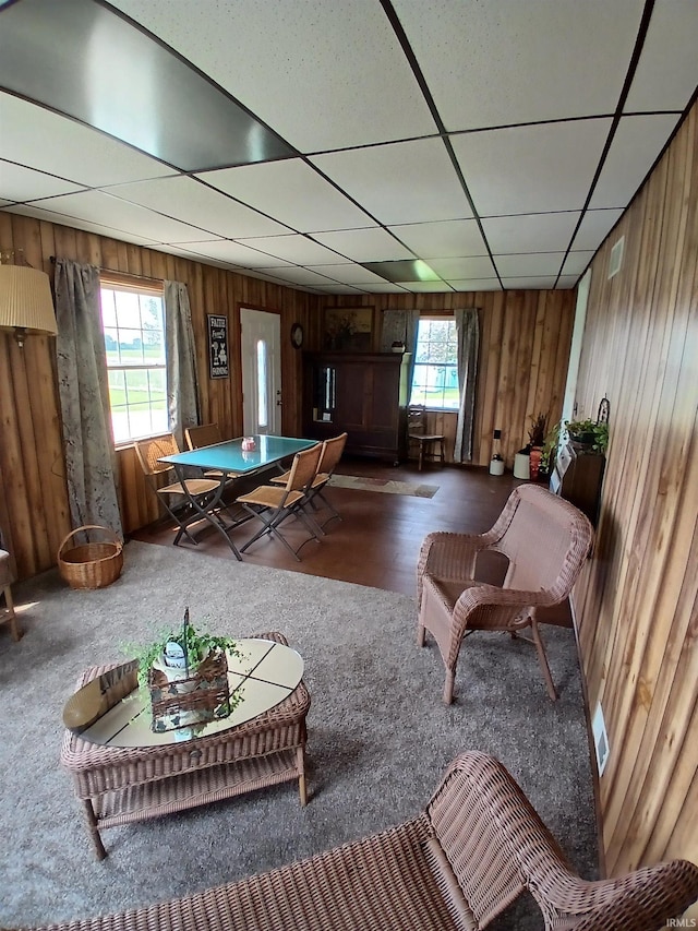 7086 S 200 E, Macy, IN 46951 - living area featuring wooden walls, carpet floors, and a drop ceiling