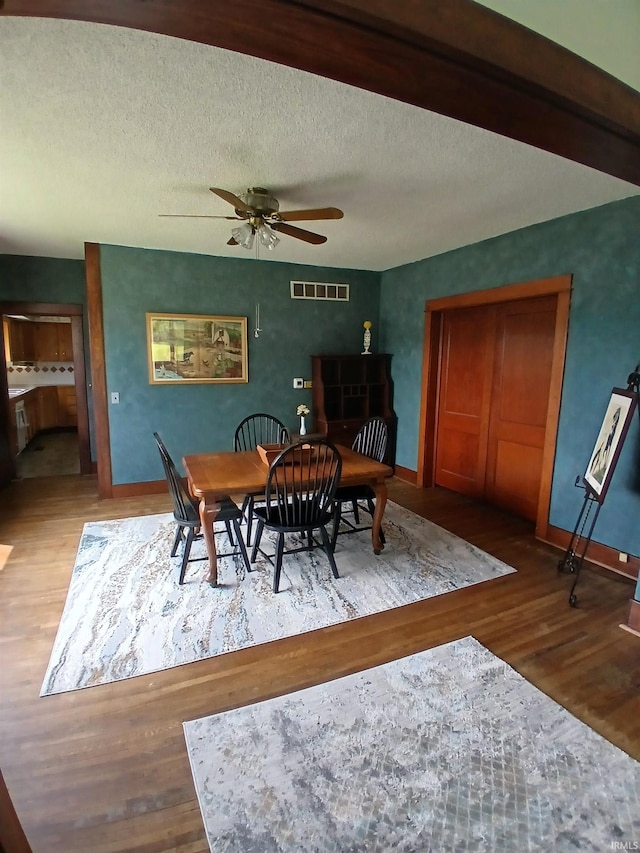 7086 S 200 E, Macy, IN 46951 - dining room with wood finished floors, ceiling fan, and a textured ceiling