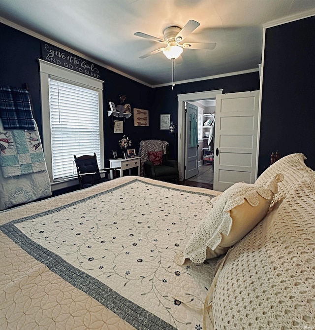 715 SE 2nd St, Washington, IN 47501 - bedroom with a walk in closet, ornamental molding, a ceiling fan, and a closet