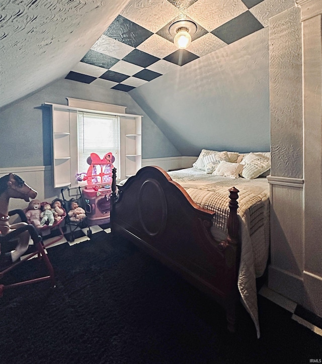 715 SE 2nd St, Washington, IN 47501 - bedroom featuring wainscoting, lofted ceiling, a textured ceiling, and carpet