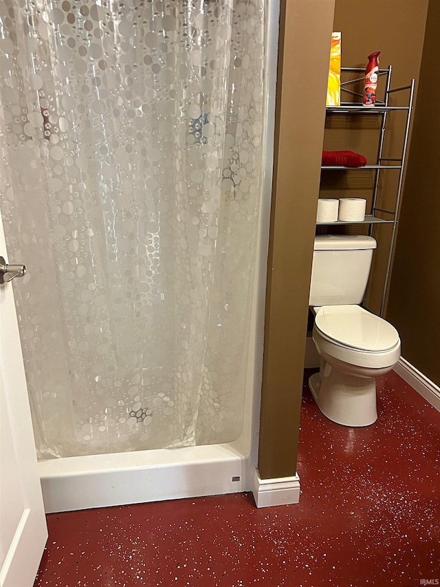 715 SE 2nd St, Washington, IN 47501 - bathroom with baseboards and a shower with shower curtain