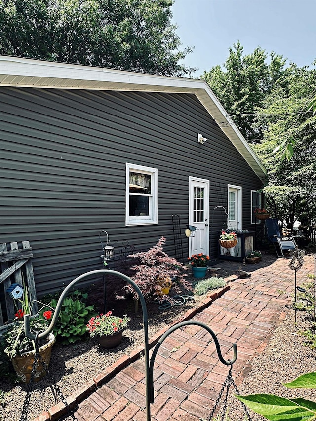 715 SE 2nd St, Washington, IN 47501 - rear view of house featuring a patio