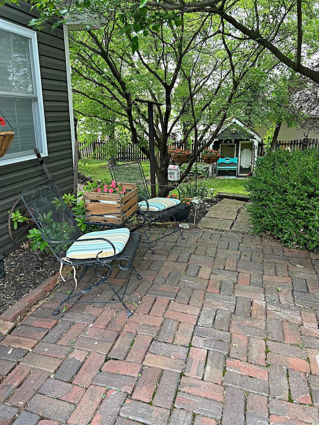 715 SE 2nd St, Washington, IN 47501 - view of patio / terrace featuring a shed