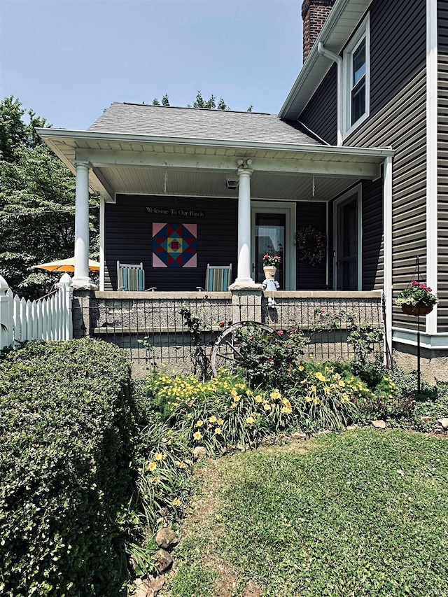 715 SE 2nd St, Washington, IN 47501 - entrance to property with covered porch, a chimney, and a shingled roof