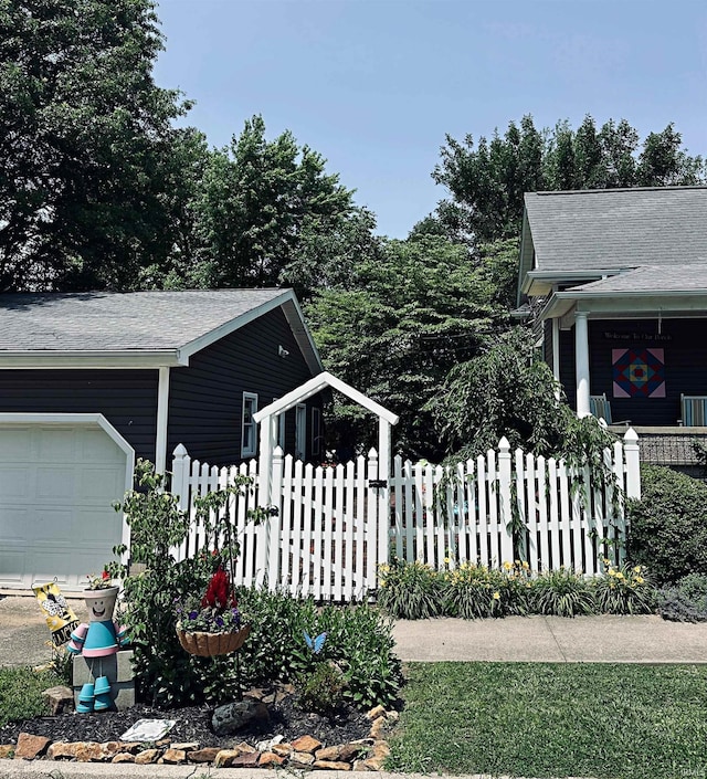 715 SE 2nd St, Washington, IN 47501 - view of property exterior featuring an attached garage and roof with shingles