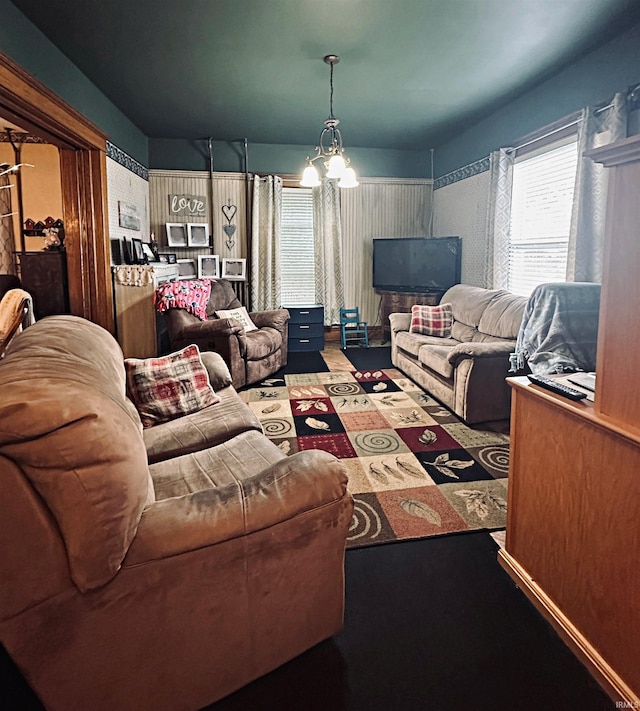 715 SE 2nd St, Washington, IN 47501 - living area featuring a chandelier and healthy amount of natural light