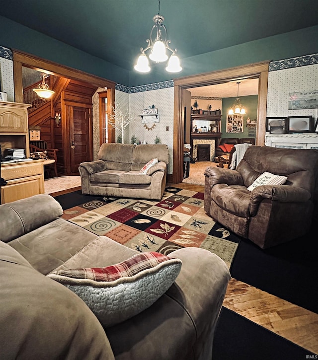 715 SE 2nd St, Washington, IN 47501 - living room featuring a chandelier, wallpapered walls, and wood finished floors
