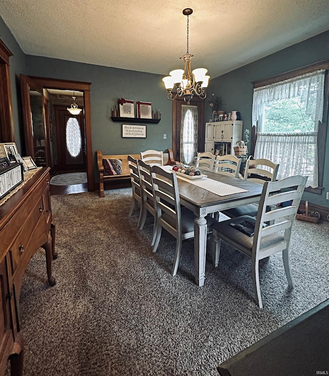 715 SE 2nd St, Washington, IN 47501 - dining area with a chandelier, dark colored carpet, and a textured ceiling