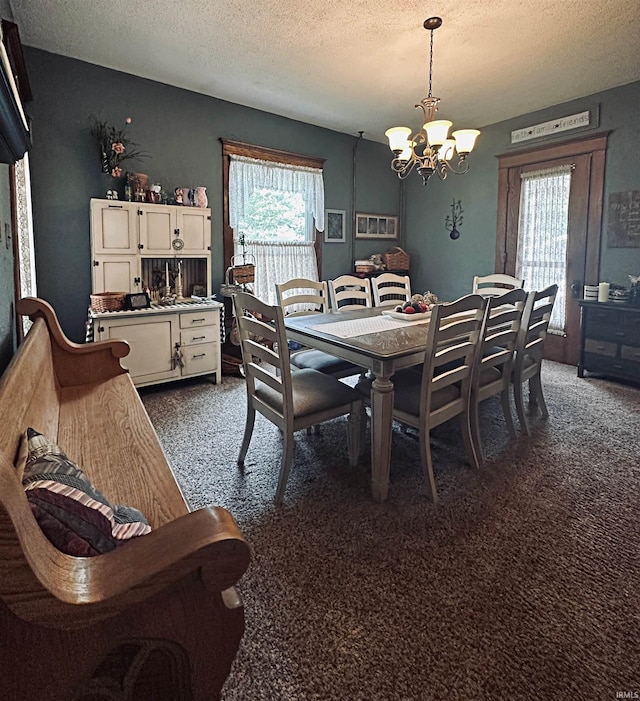 715 SE 2nd St, Washington, IN 47501 - dining room featuring dark colored carpet, a chandelier, and a textured ceiling
