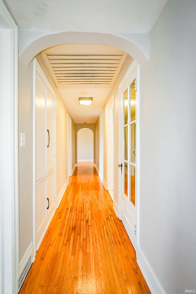 2801 W University Ave, Muncie, IN 47304 - hall featuring arched walkways and light wood-type flooring
