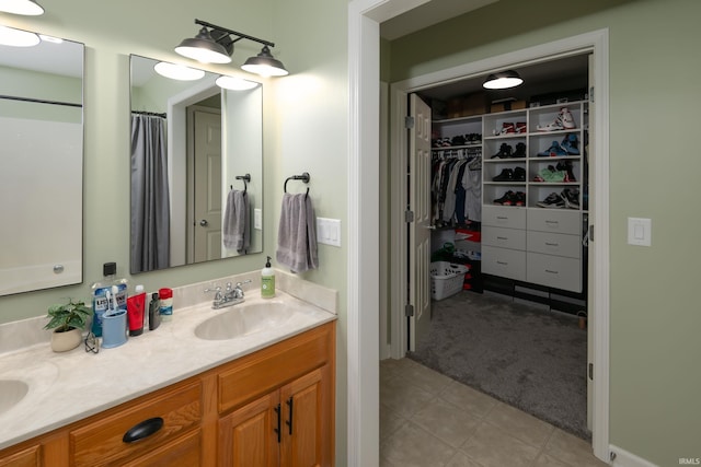 1811 Apopka Way, Fort Wayne, IN 46814 - bathroom featuring double vanity, a spacious closet, and curtained shower