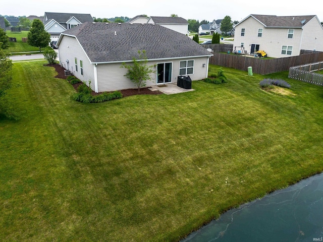 1811 Apopka Way, Fort Wayne, IN 46814 - back of house featuring roof with shingles, a residential view, and a patio area