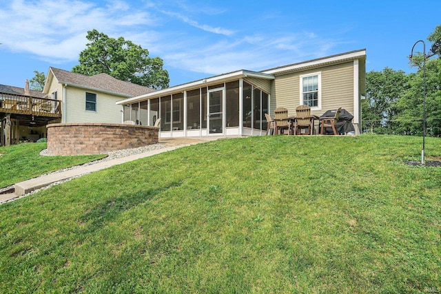 51 Ems W26 Ln, North Webster, IN 46555 - back of property with a sunroom and a lawn