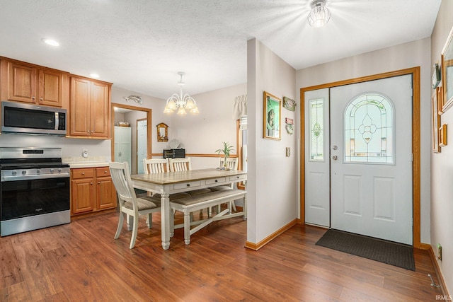 51 Ems W26 Ln, North Webster, IN 46555 - entryway featuring a chandelier, wood finished floors, and recessed lighting