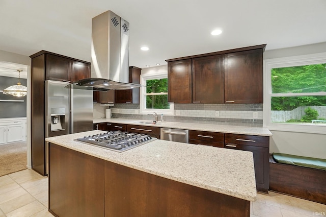 5820 Rosedale Dr, Fort Wayne, IN 46804 - kitchen with island range hood, appliances with stainless steel finishes, light tile patterned floors, a kitchen island, and dark brown cabinets