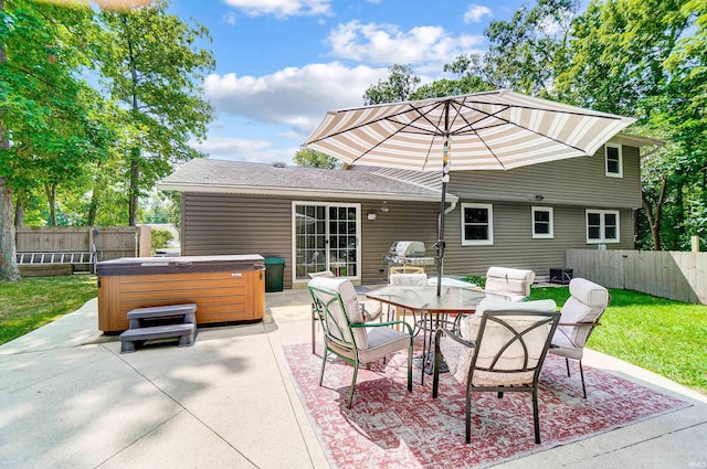 5820 Rosedale Dr, Fort Wayne, IN 46804 - fenced backyard featuring a hot tub, a patio, outdoor dining space, and area for grilling